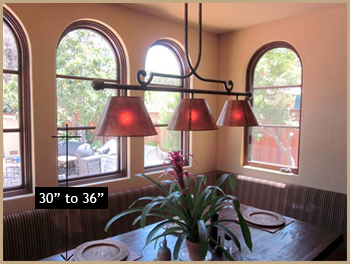 Light fixture over table with measurements